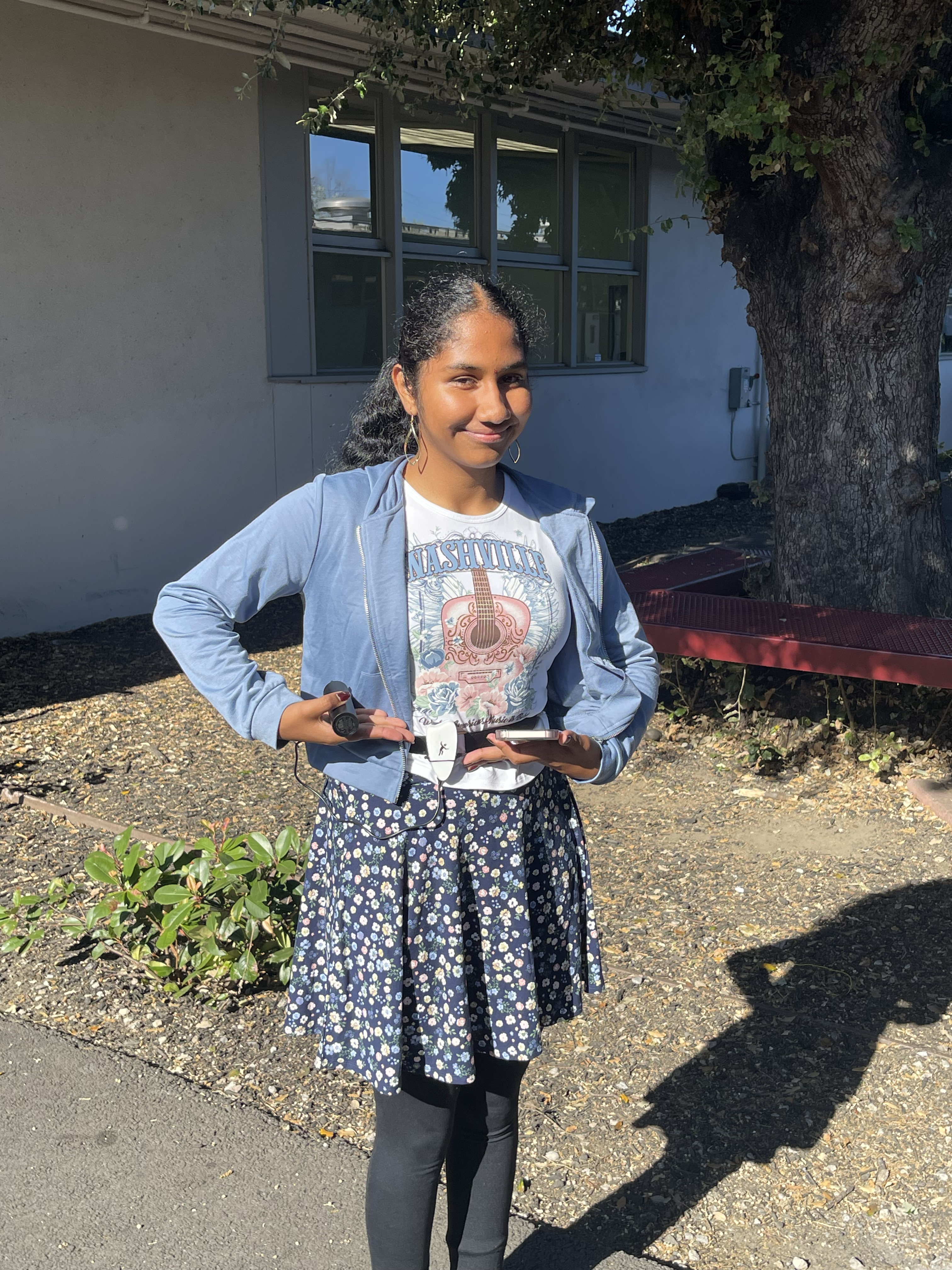 Photograph of Sruthi, Super Smart and Really Cool Engineer, wearing the Fall Detector!